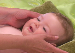 Face massage on an infant