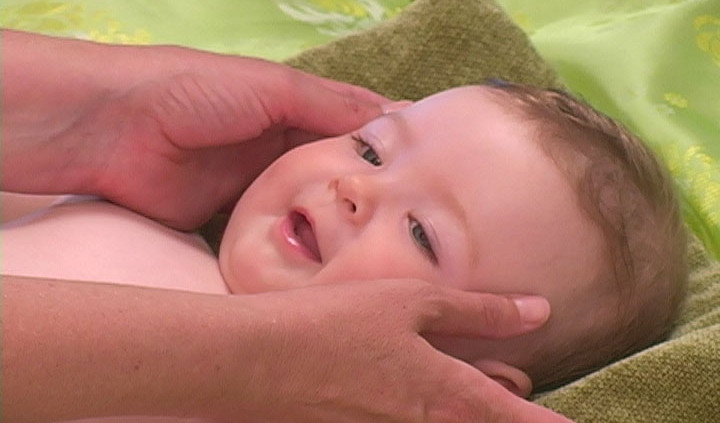 Face massage on an infant