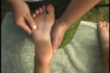 Reflexology on the foot.
