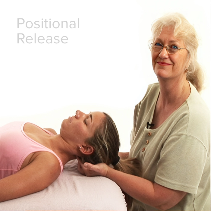 Diana Haynes performing neck massage on a client.